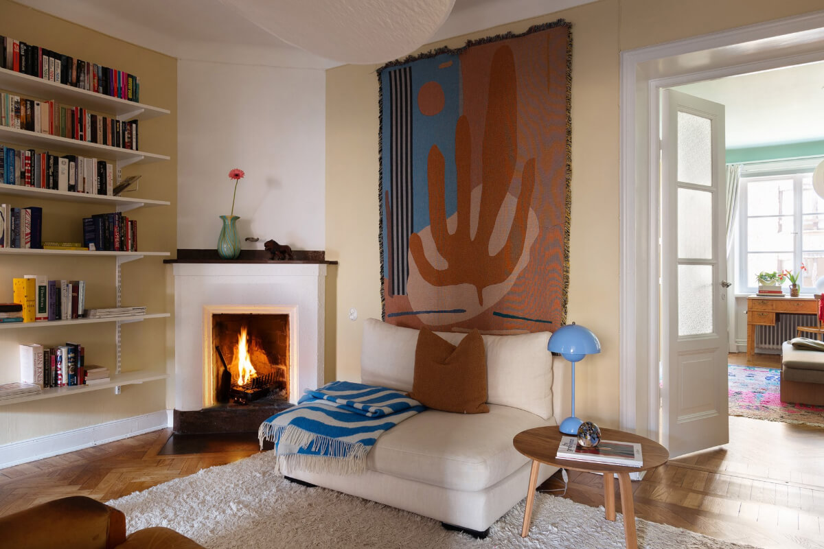 inner hall with pale yellow walls fireplace