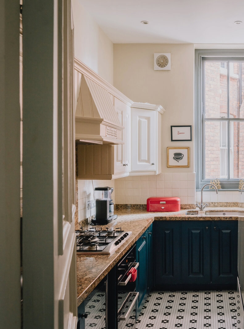 A Stunning Edwardian Apartment with High Ceilings and Period Details 9 kitchen blue cabinets black and white floor tiles