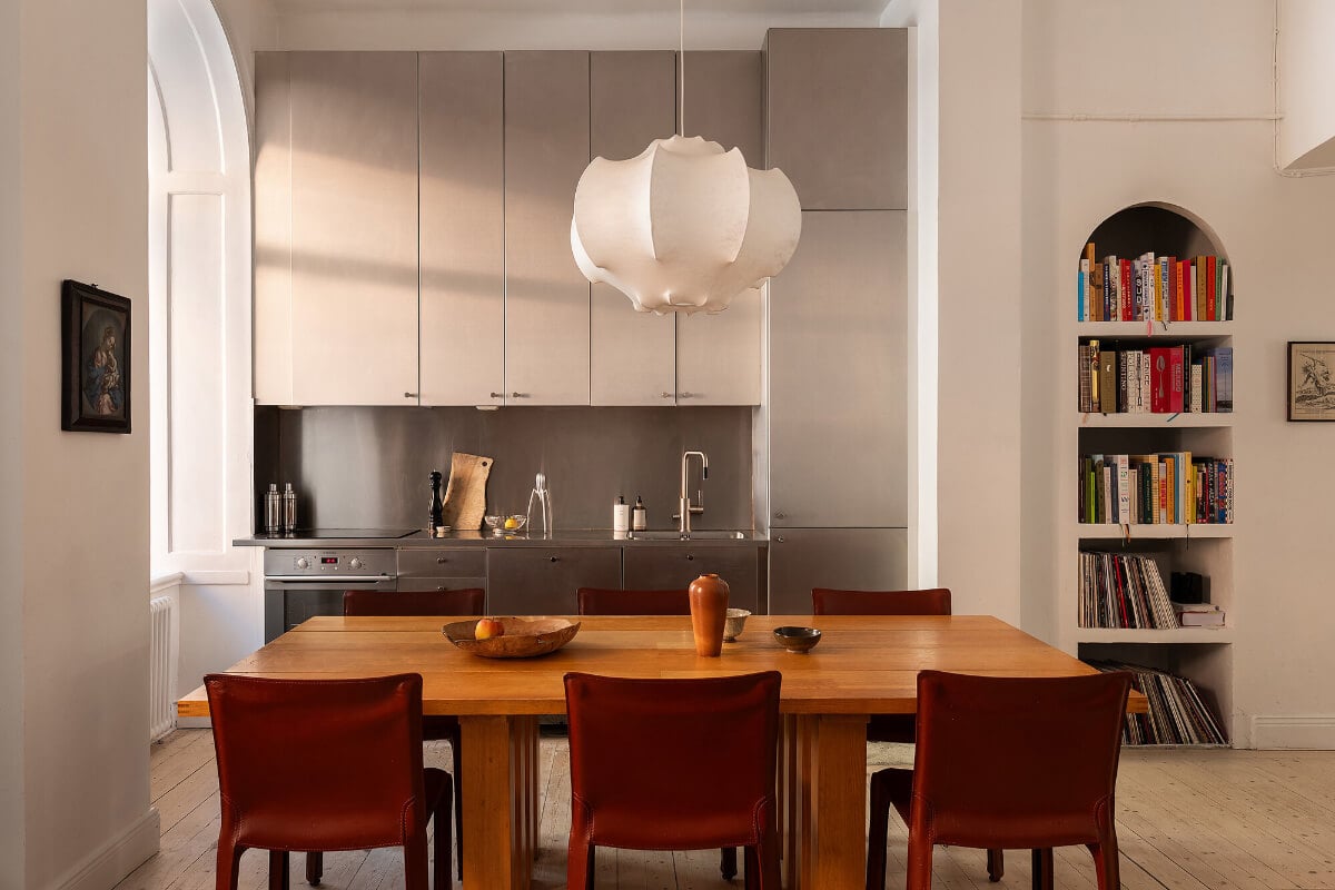 Arches and a Wall Mural in a Swedish Apartment 10 kitchen large dining table