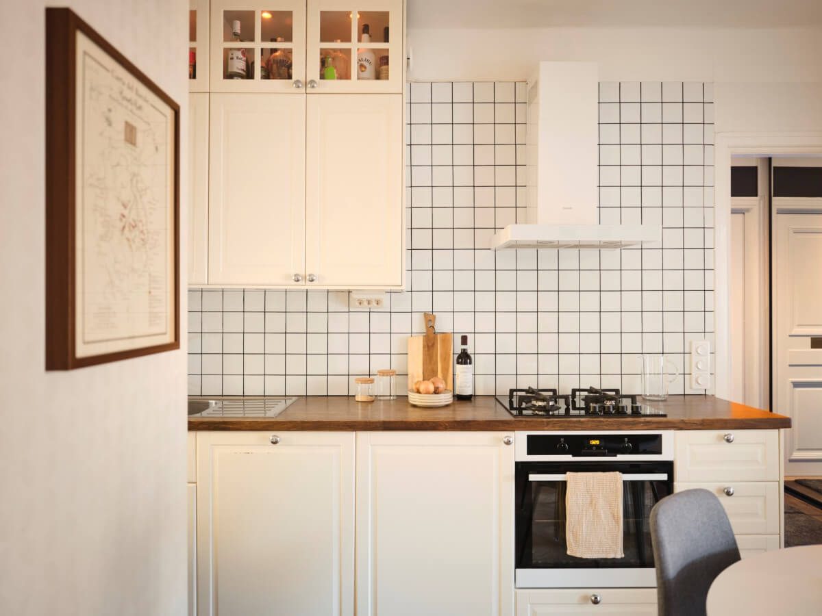 A Light-Filled 1920s Apartment with Two Spacious Balconies 13 kitchen white backsplash tiles