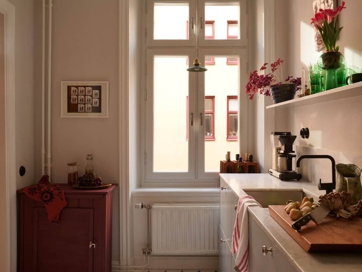 Revisiting a Bright Scandi Apartment with a Gray Kitchen 13 kitchen window