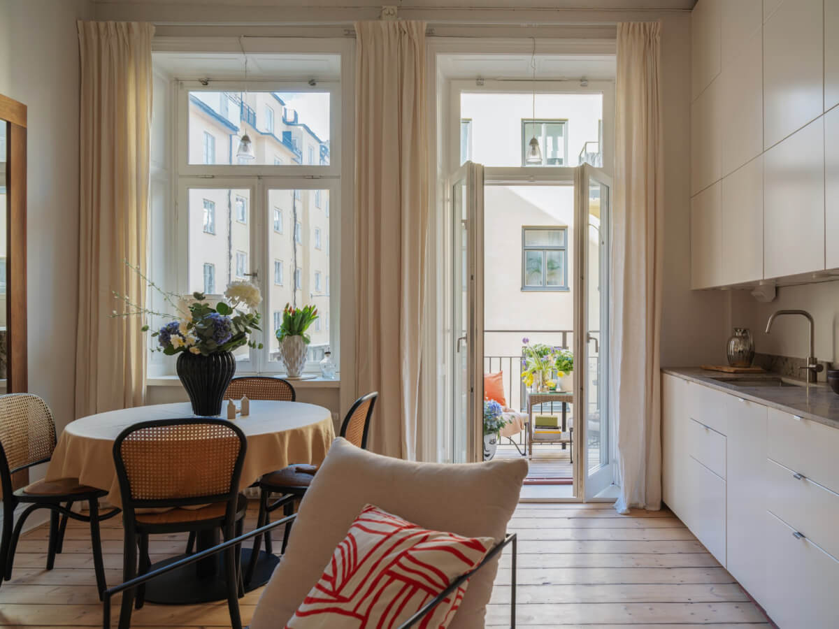 A Small Apartment with Contemporary Furniture in a 19th-Century Building 4 large windows and glass doors to balcony