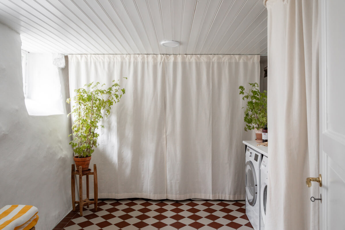 Turn-of-the-Century Charm Meets Modern Comfort in a Swedish House 29 laundry room checkerboard floor