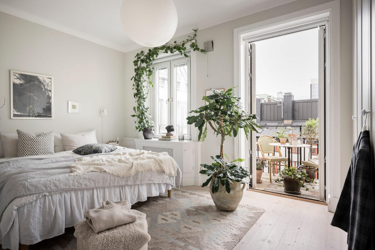 A Light Color Palette in a Stylish Renovated Late 19th Century Apartment 16 light bedroom plants balcony A Light Color Palette in a Stylish Renovated Late 19th Century Apartment