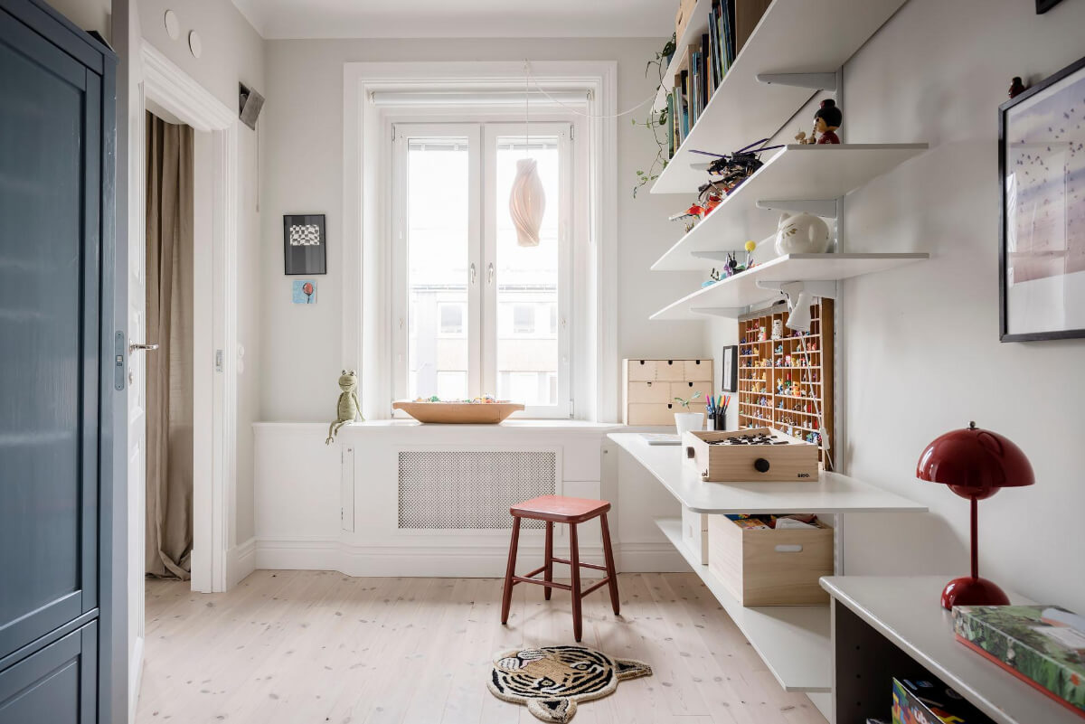 A Light Color Palette in a Stylish Renovated Late 19th Century Apartment 27 light childrens room shelves