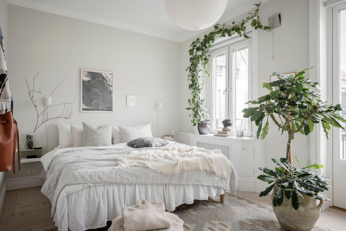 A Light Color Palette in a Stylish Renovated Late 19th Century Apartment 14 light colored scandi bedroom plants