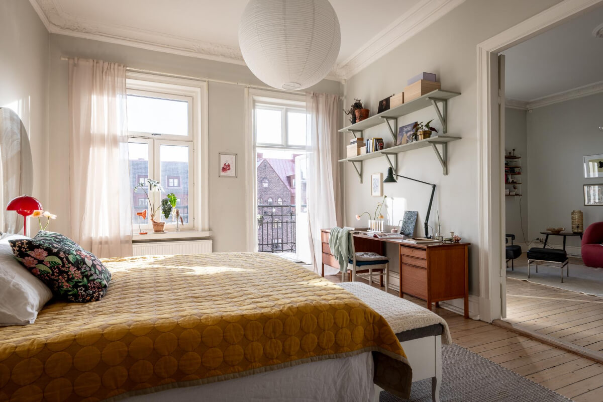 A Light and Spacious Apartment with a Cozy Social Kitchen 13 light gray bedroom with midcentury desk