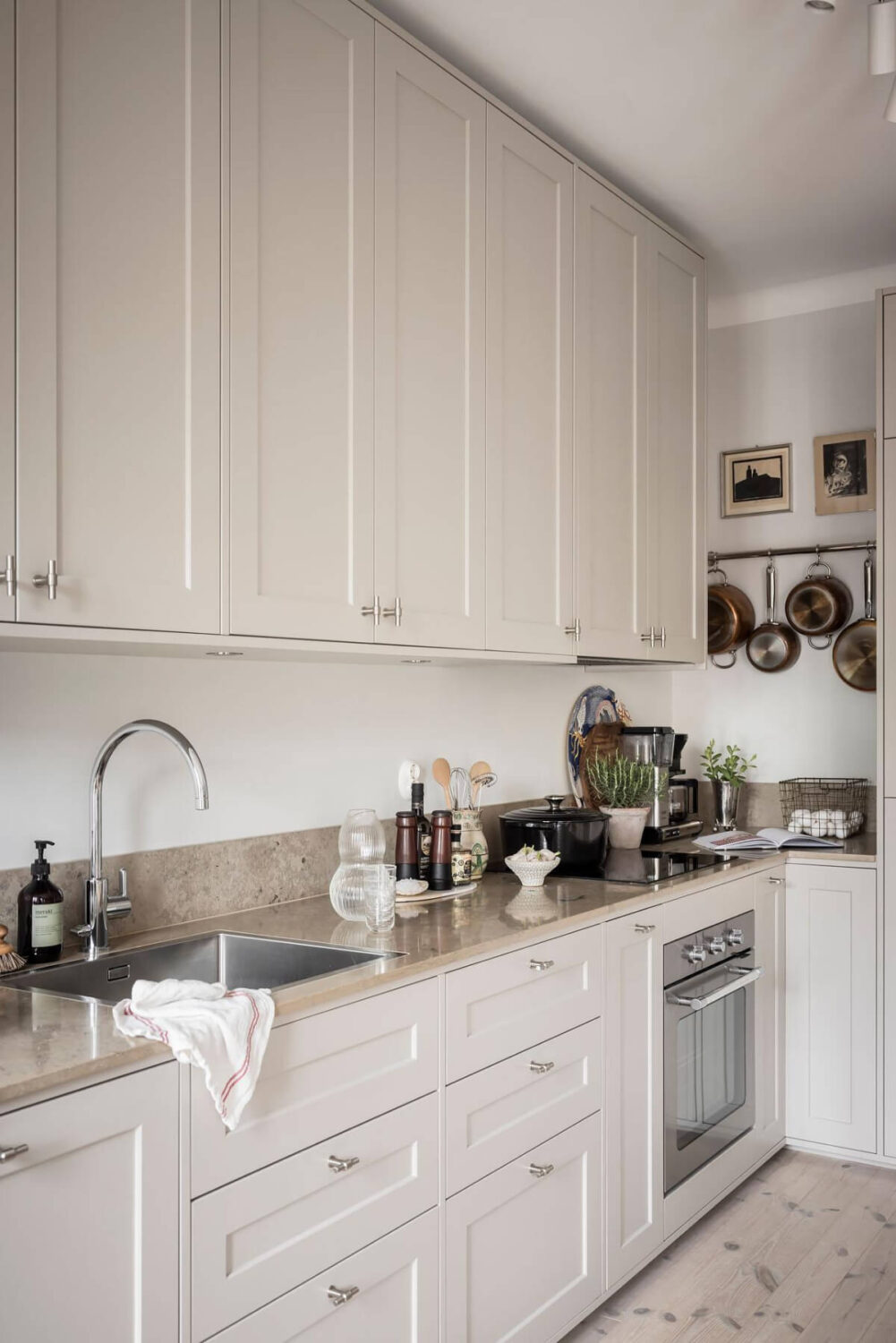 A Light Color Palette in a Stylish Renovated Late 19th Century Apartment 10 light gray beige kitchen