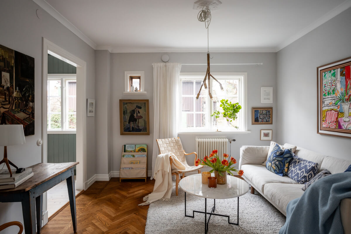 Turn-of-the-Century Charm Meets Modern Comfort in a Swedish House 1 light gray living room parquet floor