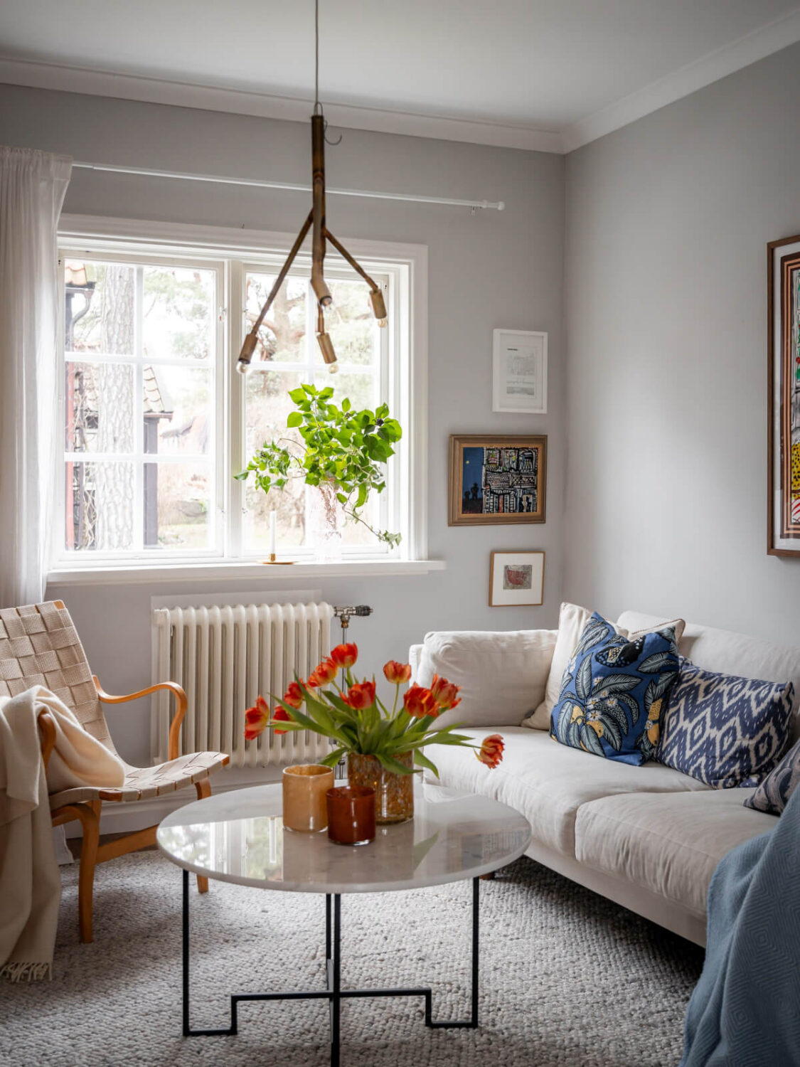 Turn-of-the-Century Charm Meets Modern Comfort in a Swedish House 2 light gray walls scandi sitting room