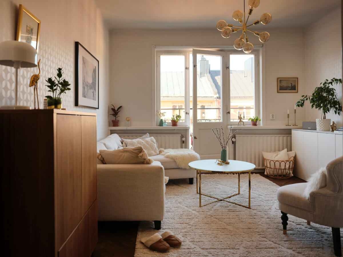 A Light-Filled 1920s Apartment with Two Spacious Balconies 4 light living room with wallpapered walls