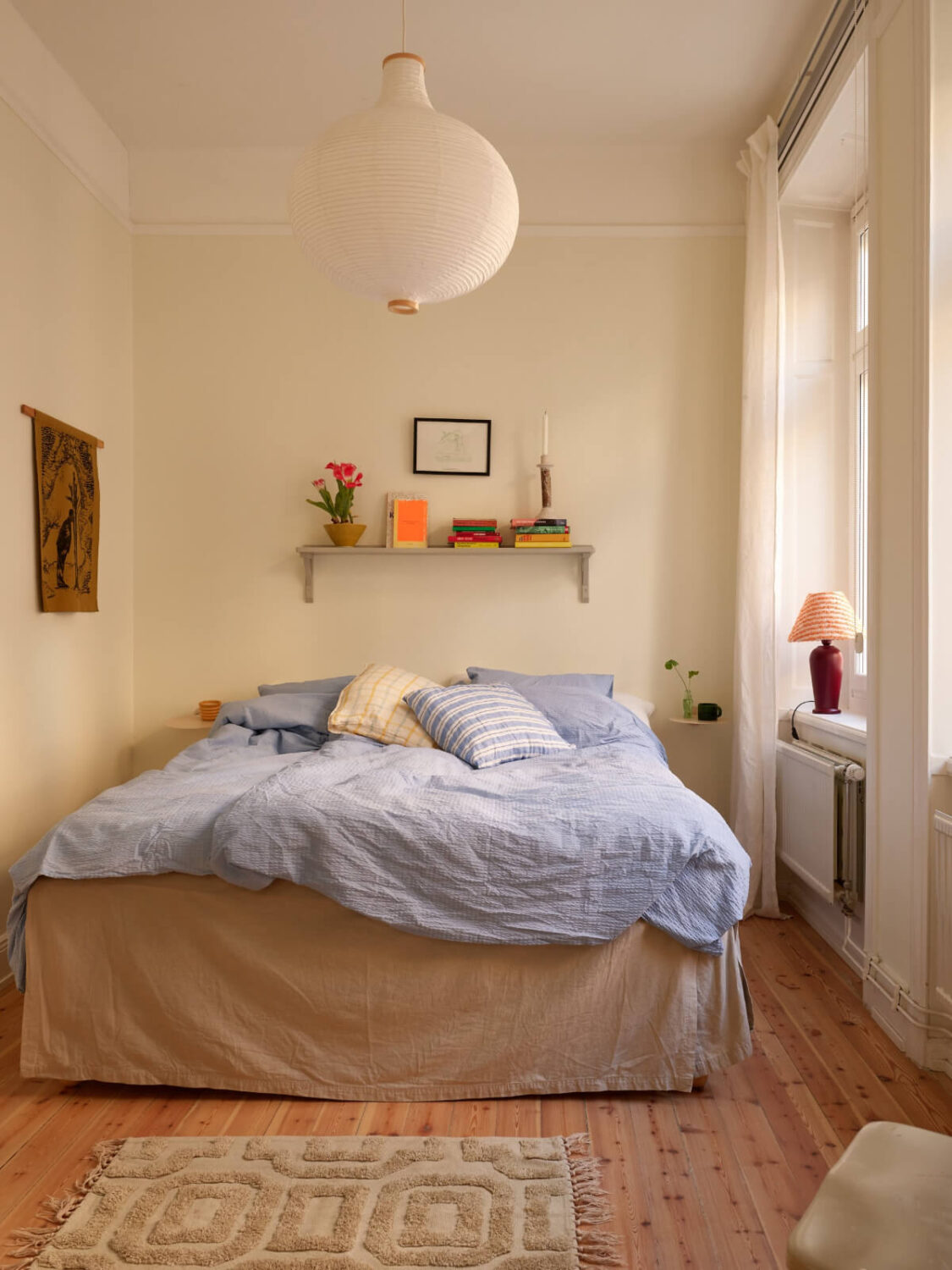 Revisiting a Bright Scandi Apartment with a Gray Kitchen 16 light scandi bedroom wooden floor