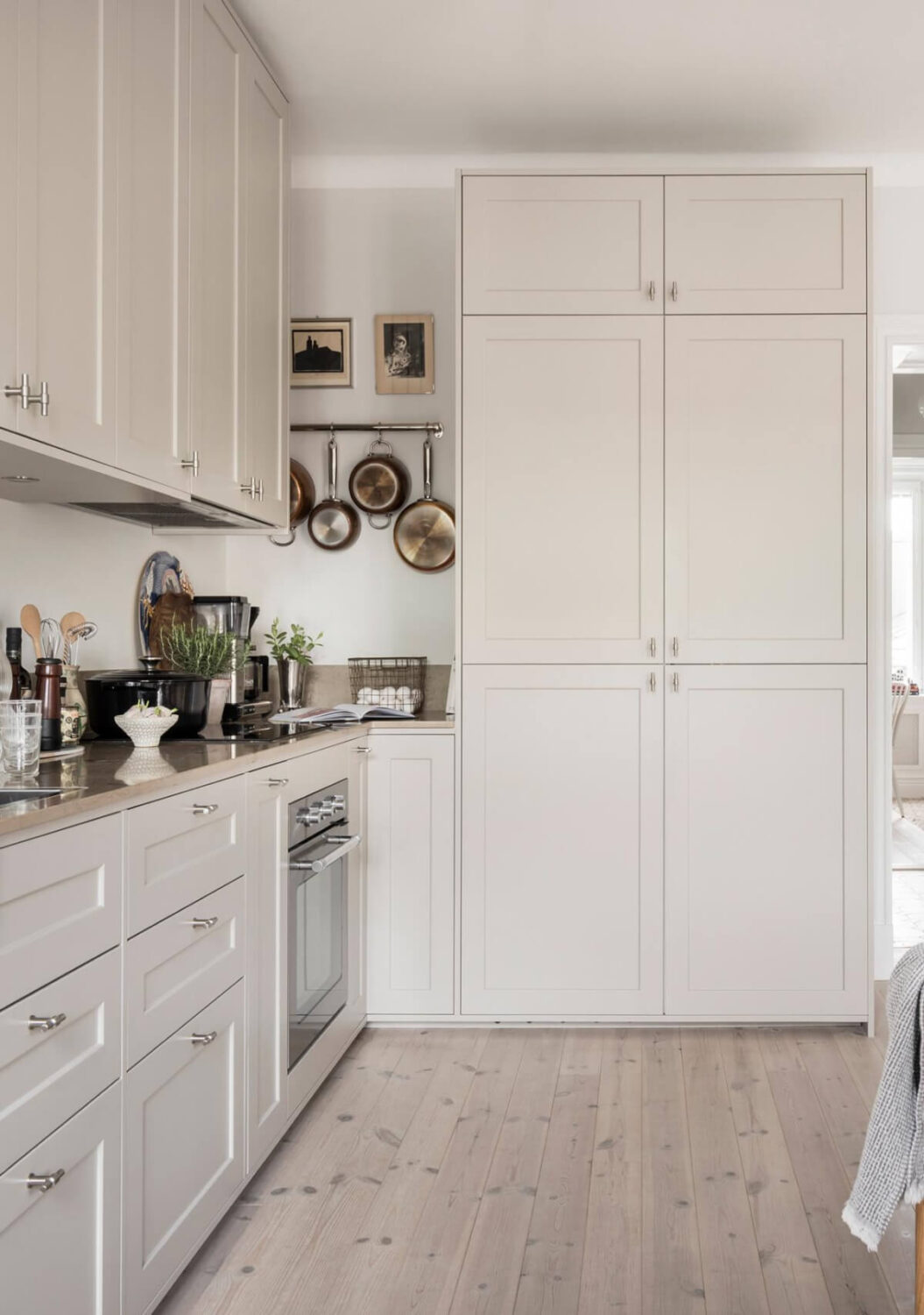 A Light Color Palette in a Stylish Renovated Late 19th Century Apartment 11 light scandi kitchen