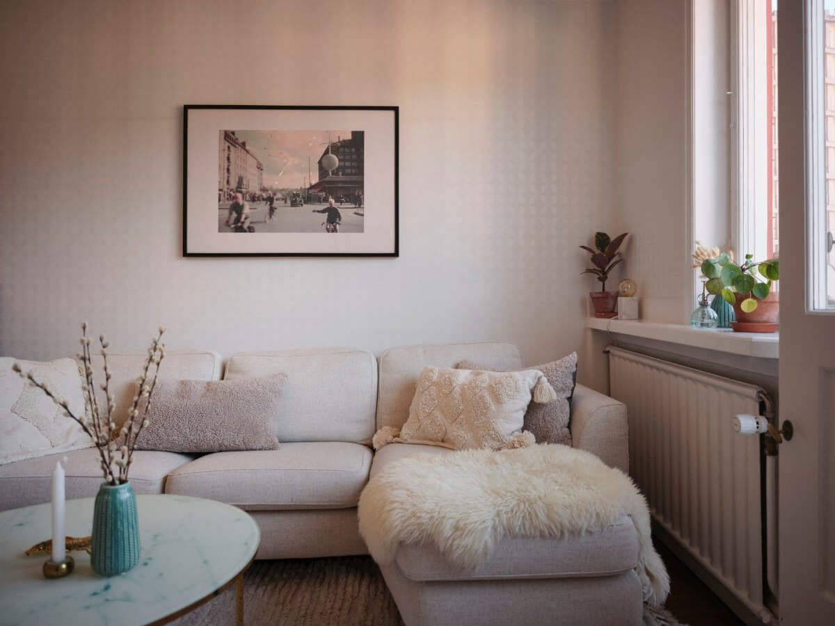 A Light-Filled 1920s Apartment with Two Spacious Balconies 8 living room sofa