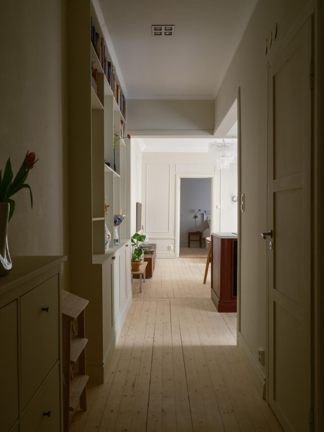 A Serene 19th Century Apartment with a Deep Red Kitchen 20 open hall into living spaces