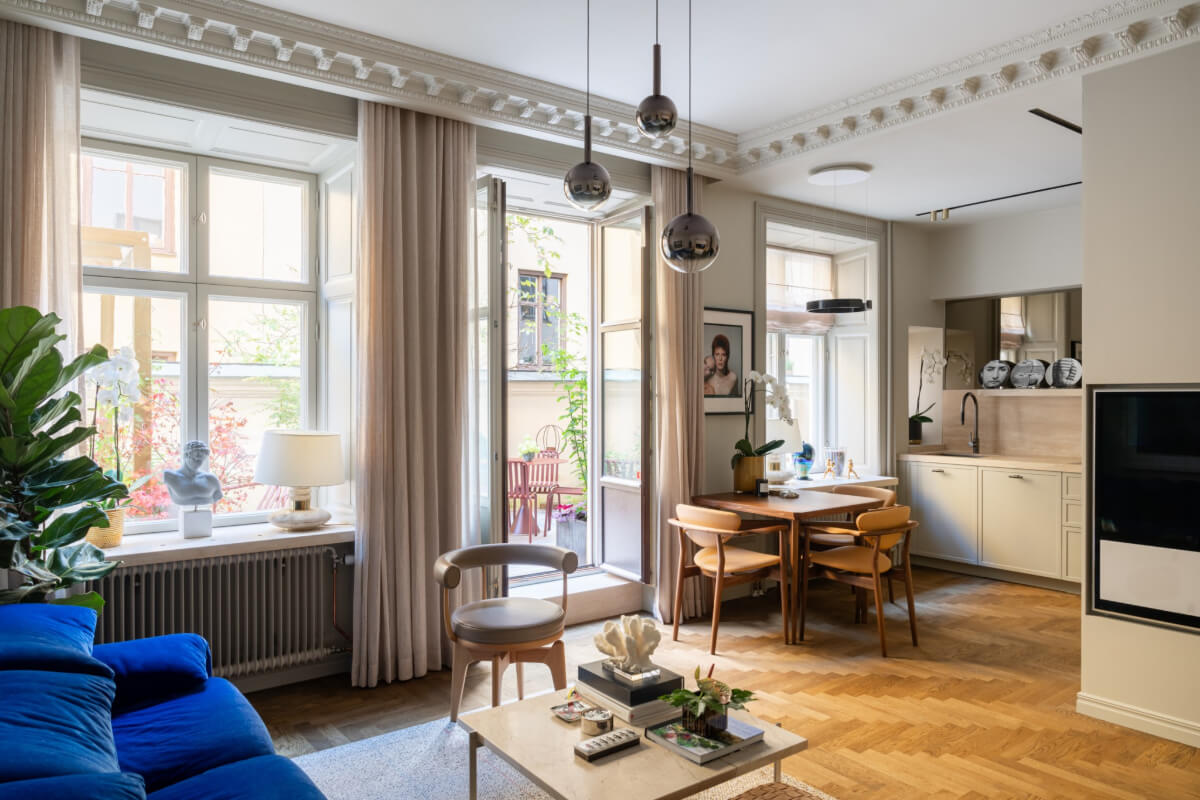 Hotel-Style Interiors in a Late 19th Century Apartment in Stockholm 1 open plan living room parquet floor