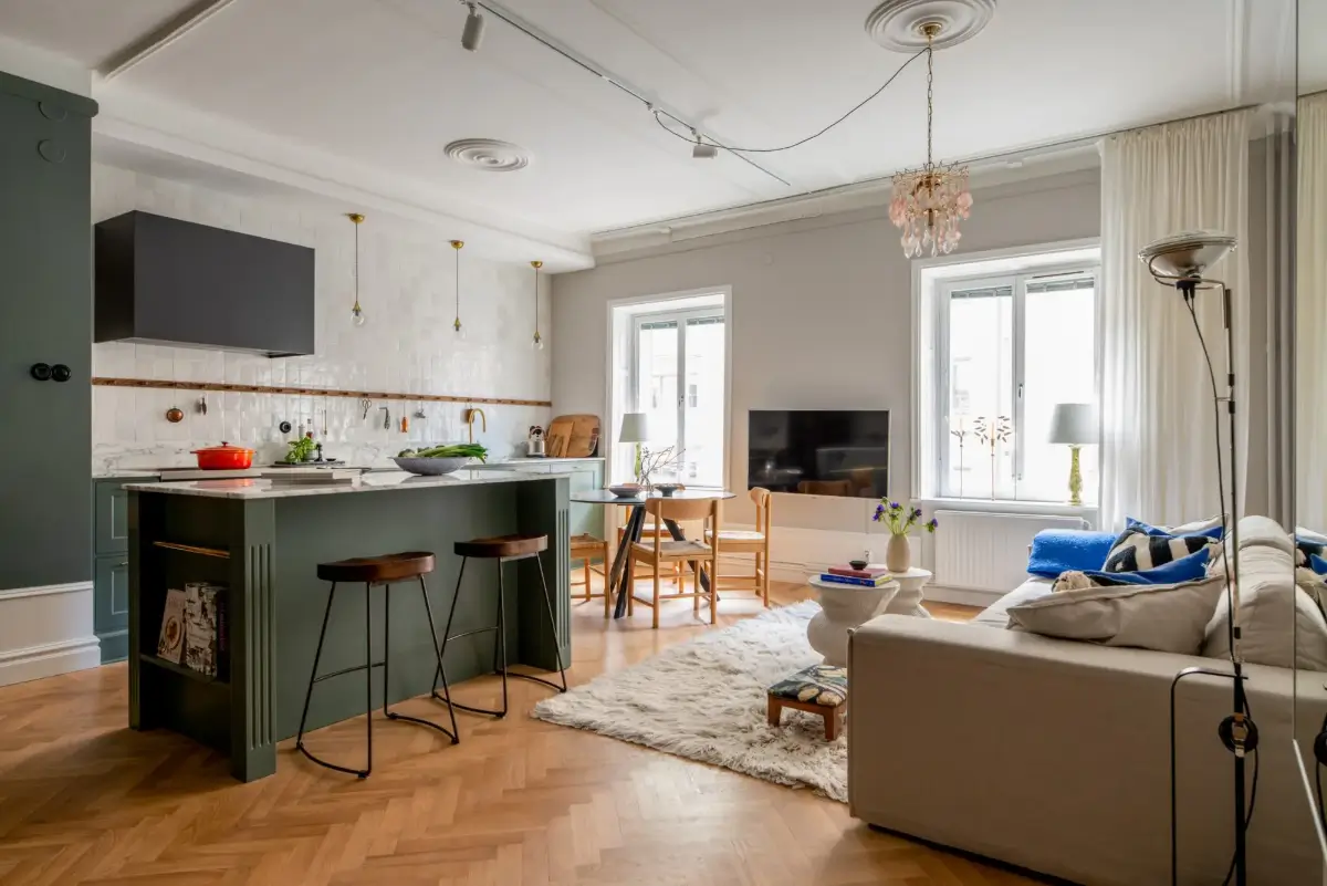 A Green Kitchen in a Classic Scandinavian Apartment 1 open-plan-living-space-green-kitchen-herringbone-parquet-floor
