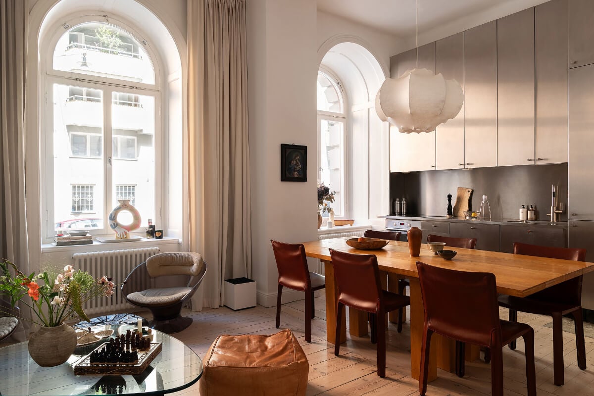 Arches and a Wall Mural in a Swedish Apartment 8 open plan living space large windows wooden floor