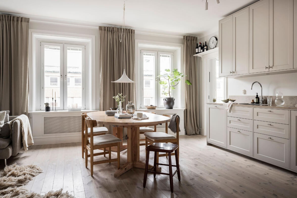 A Light Color Palette in a Stylish Renovated Late 19th Century Apartment 6 open plan living space large wooden dining table