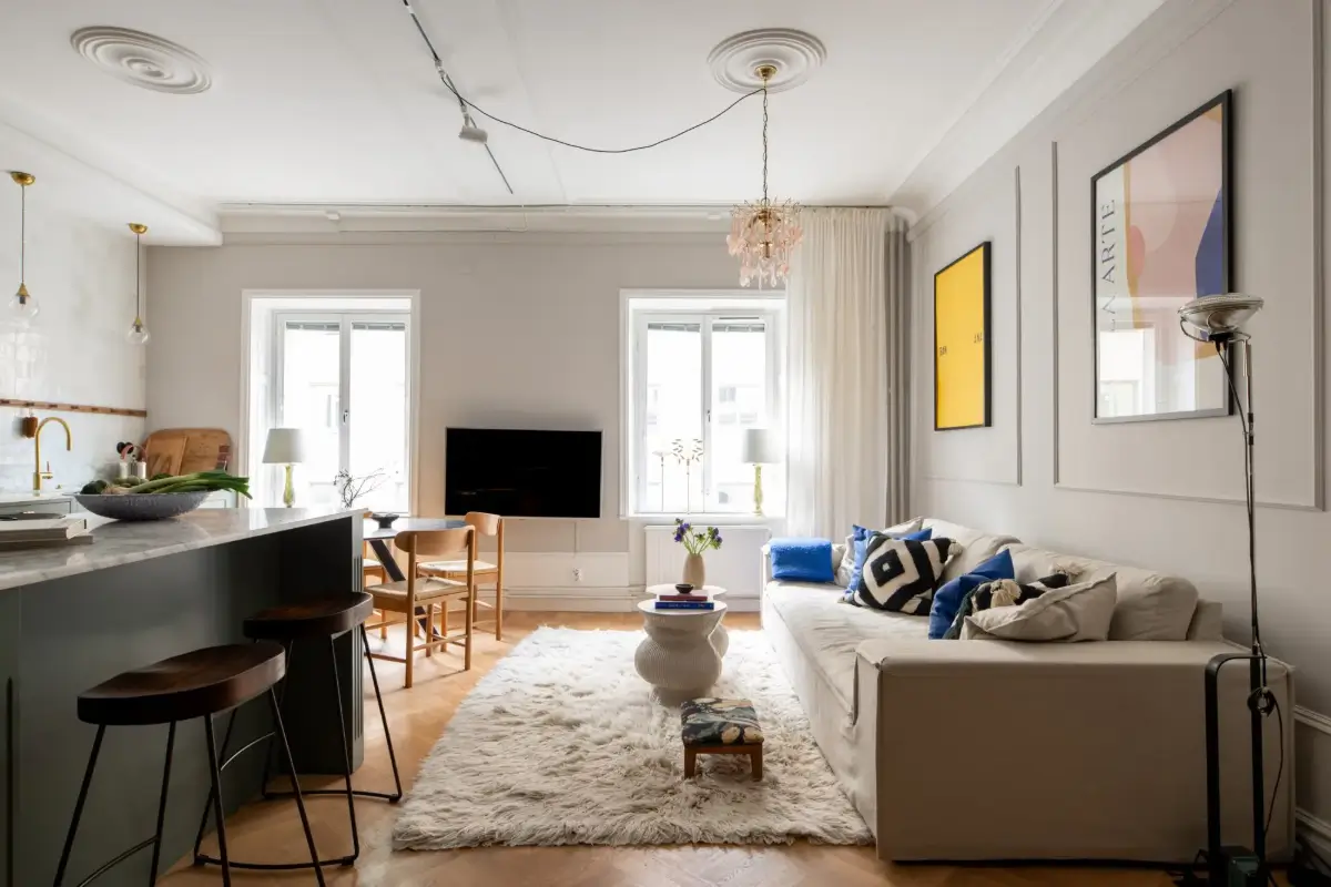 A Green Kitchen in a Classic Scandinavian Apartment 2 open plan living space light gray walls green kitchen
