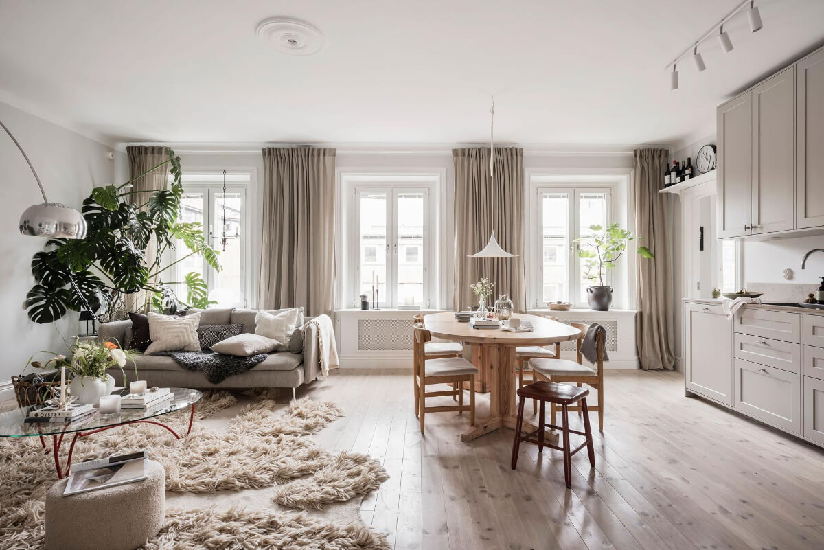 A Light Color Palette in a Stylish Renovated Late 19th Century Apartment 3 open plan living space wooden floor large rug