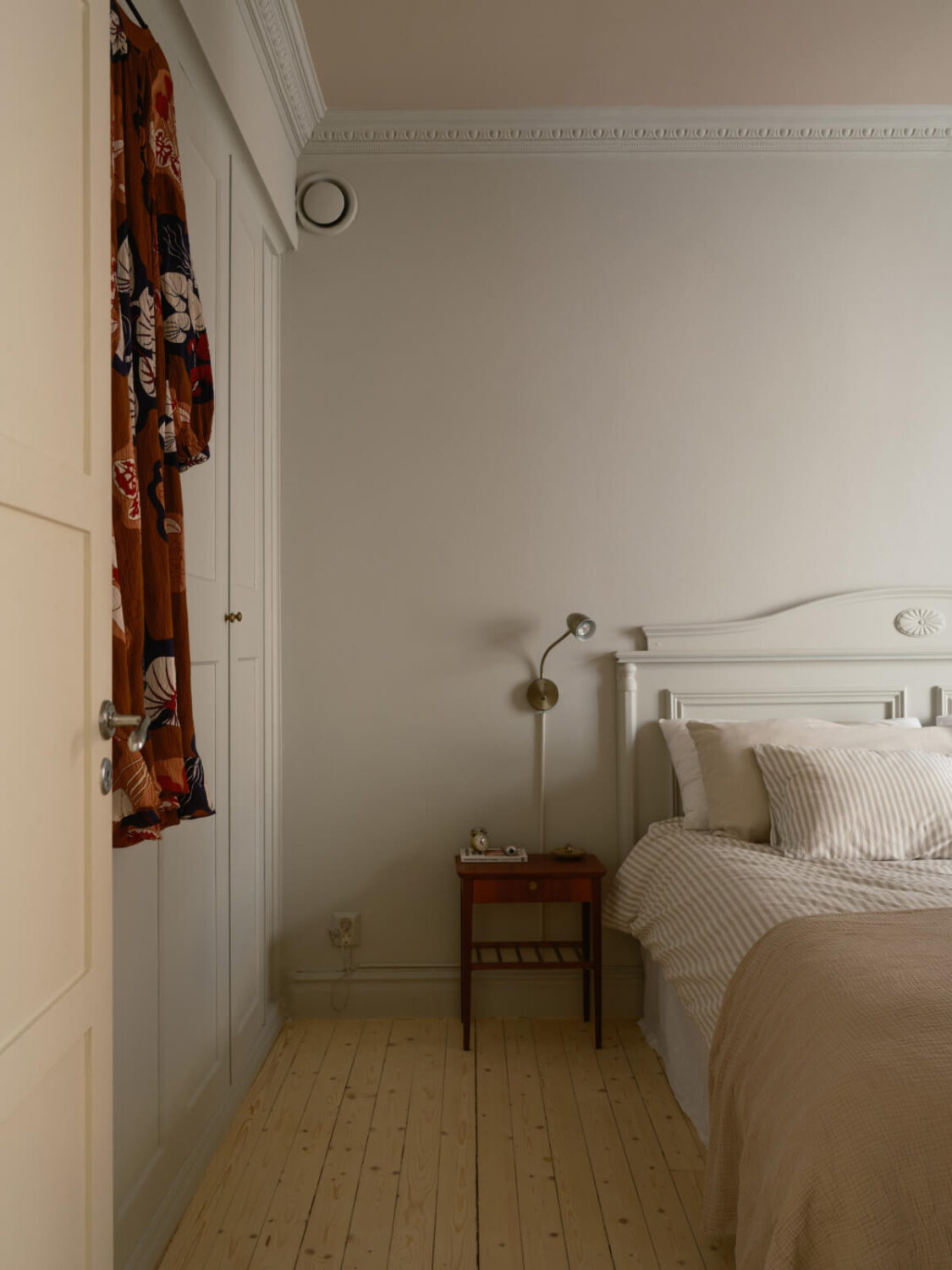 A Serene 19th Century Apartment with a Deep Red Kitchen 13 painted ceiling bedroom built-in wardrobes