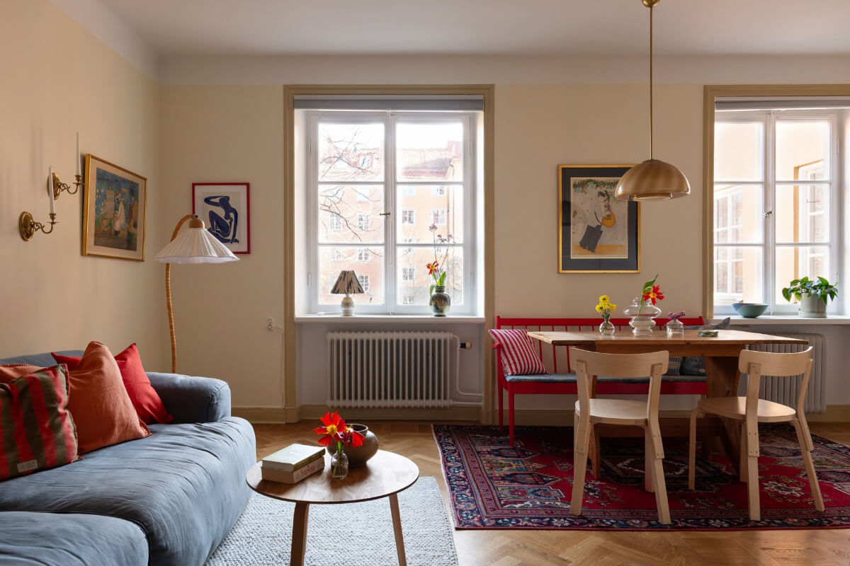 pale yellow living room dining table with red bench