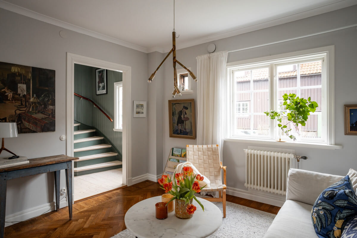 Turn-of-the-Century Charm Meets Modern Comfort in a Swedish House 4 parquet floor small sitting room