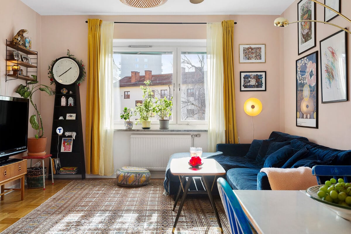 pink living room yellow curtains blue velvet sofa