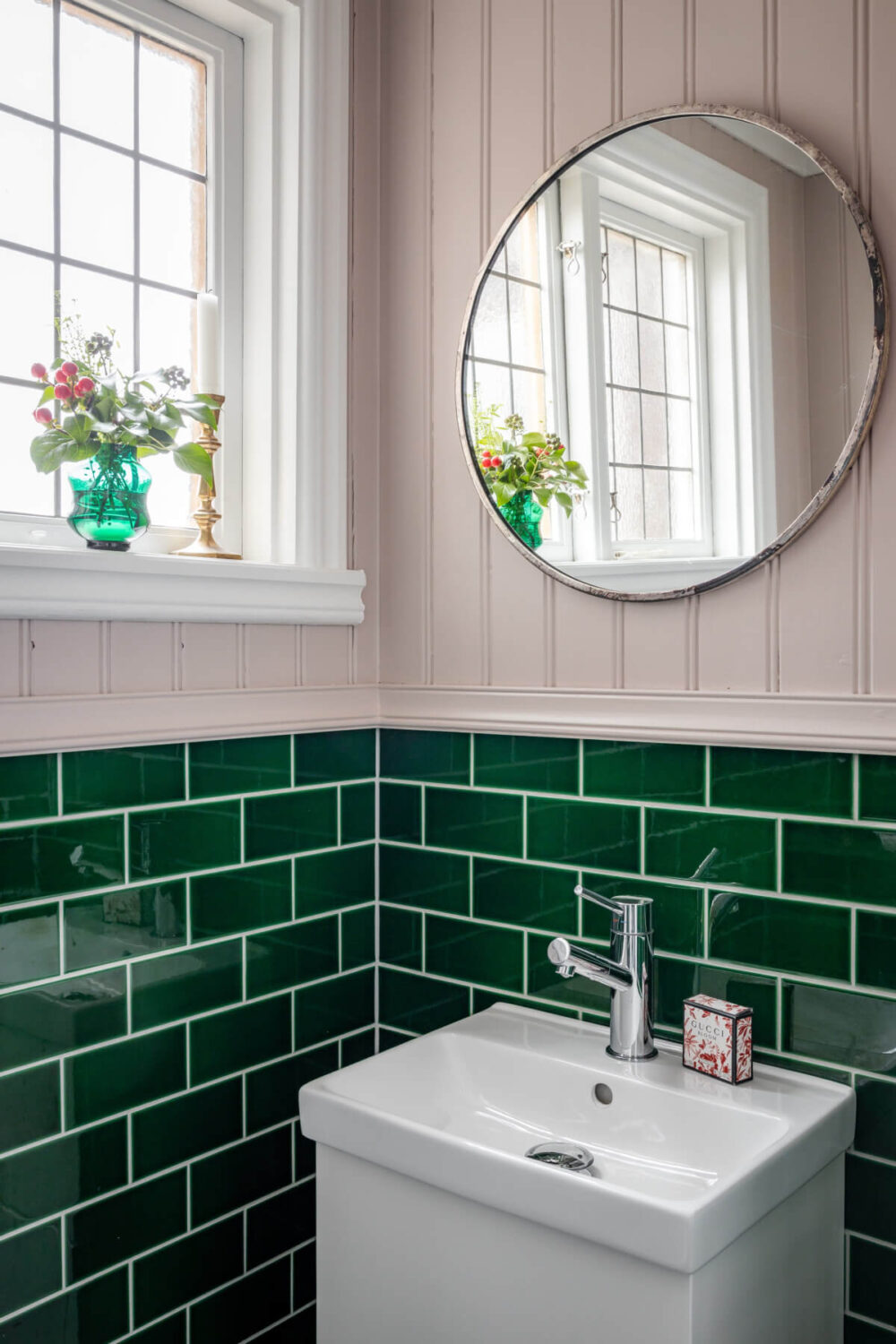 Turn-of-the-Century Charm Meets Modern Comfort in a Swedish House 14 powder room glossy green tiles