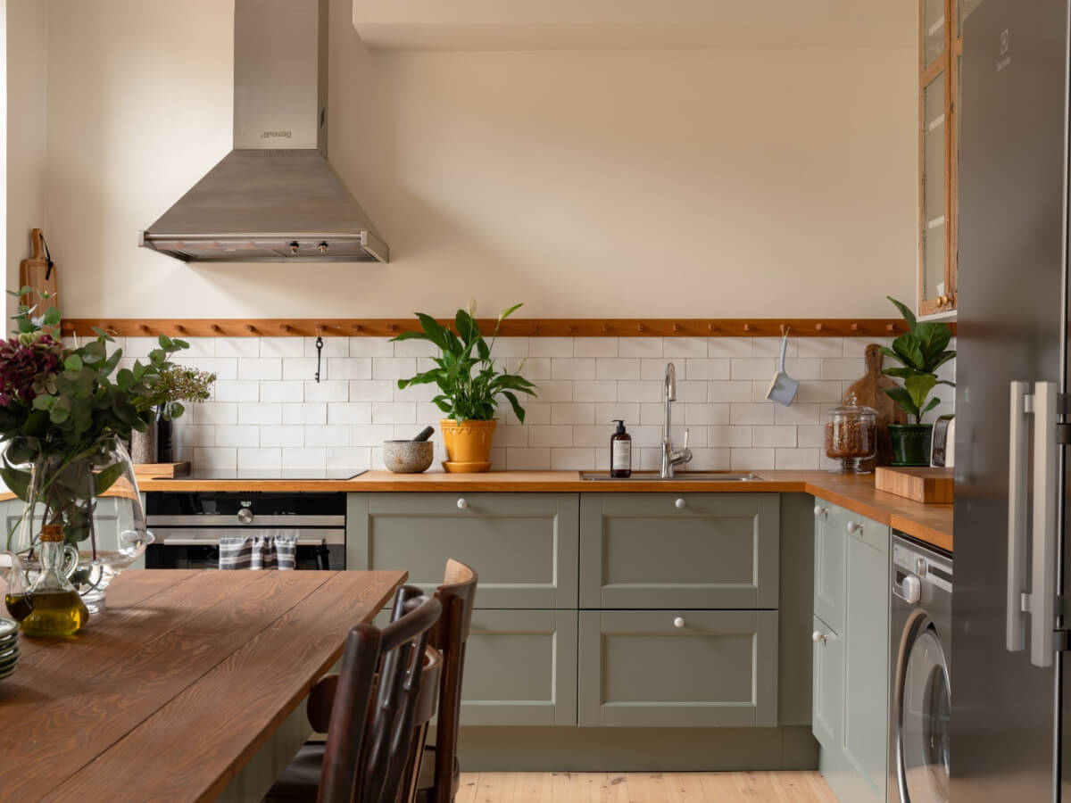 Soft Color Tones in a Renovated Turn-of-the-Century Apartment 7 sage green kitchen cabinets