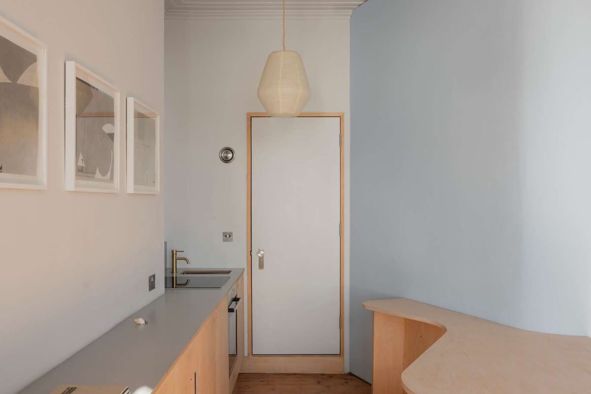 Bespoke Furniture in a Restored Seaside Apartment in England 8 simple birch ply kitchen curved island