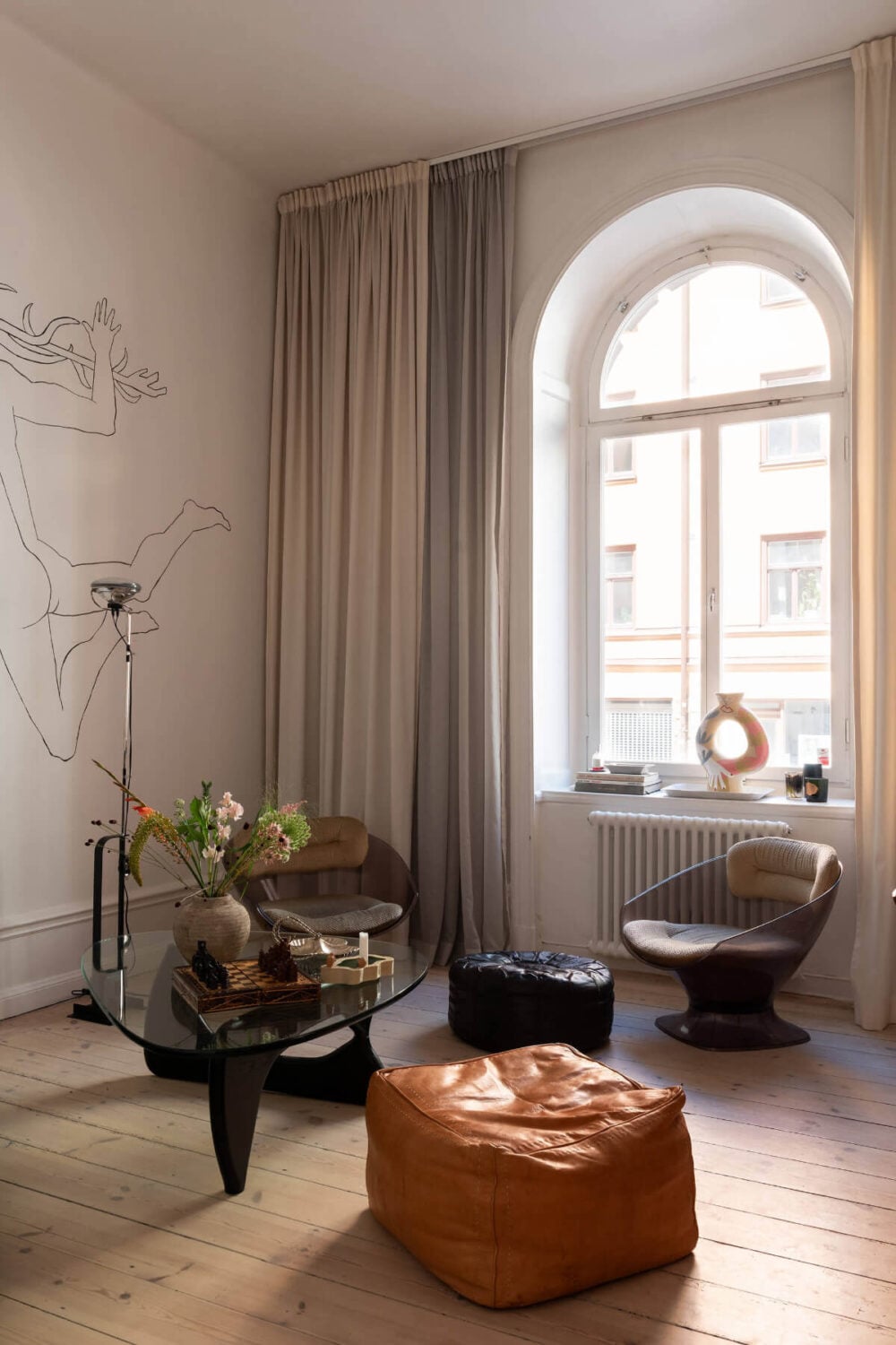 Arches and a Wall Mural in a Swedish Apartment 4 sitting room large arched window