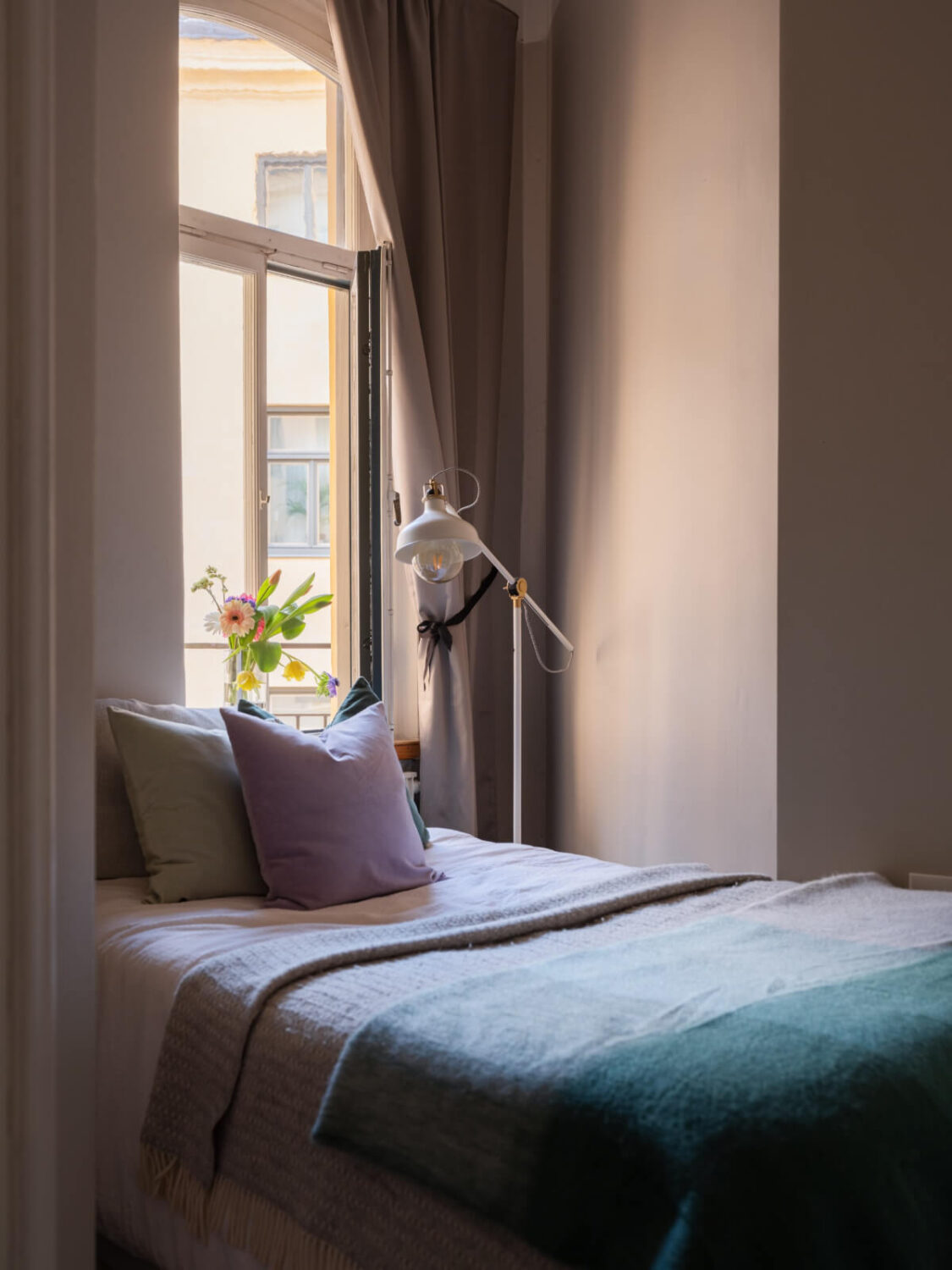 A Small Apartment with Contemporary Furniture in a 19th-Century Building 18 small bedroom bed under window