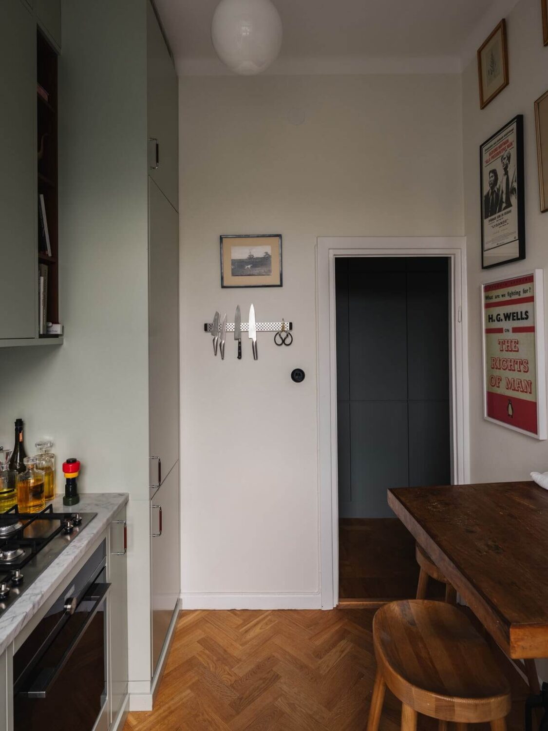 Gray Tones and Built-in Storage in a Charming Corner Apartment 13 small kitchen with high wooden bar table