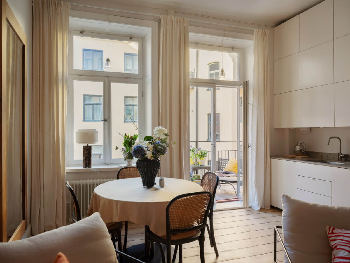 A Small Apartment with Contemporary Furniture in a 19th-Century Building 6 small living room modern white kitchen wooden floor