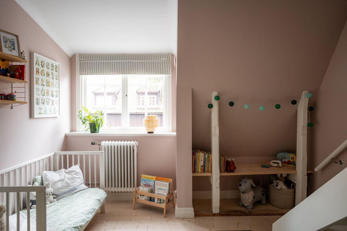 Turn-of-the-Century Charm Meets Modern Comfort in a Swedish House 24 soft pink children's room
