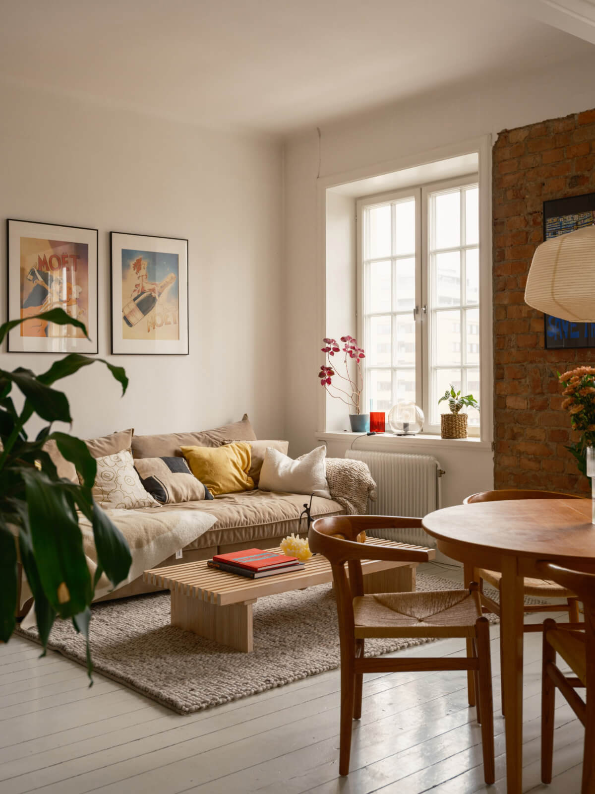 studio apartment white floorboards exposed brick