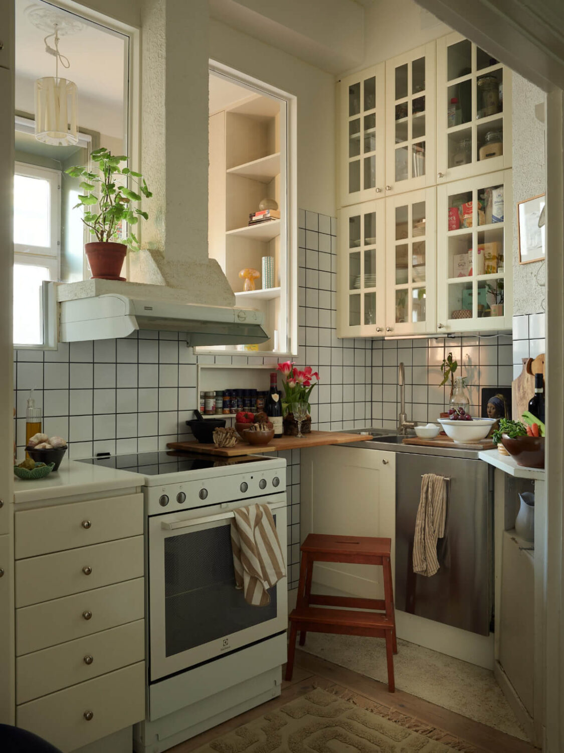 Small Space, Big Style: How to Design a Teeny-Tiny Kitchen That Works 4 tiny kitchen glass fronted cabinets inner windows