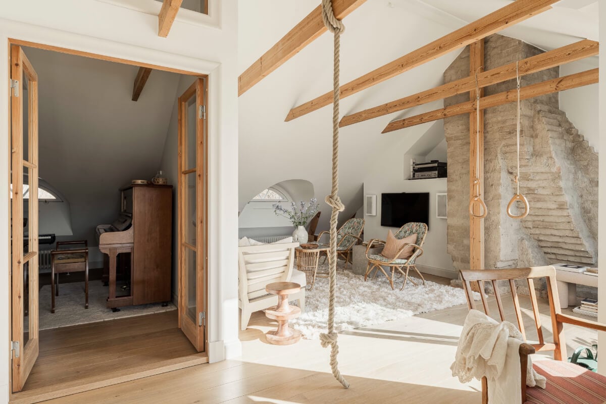 A Swedish Duplex Apartment Inspired by A Danish Summer House 11 top floor living space wooden beams music room