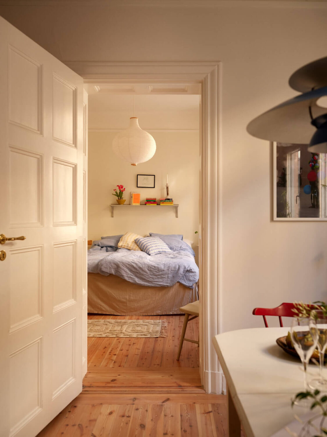 Revisiting a Bright Scandi Apartment with a Gray Kitchen 14 view into bedroom