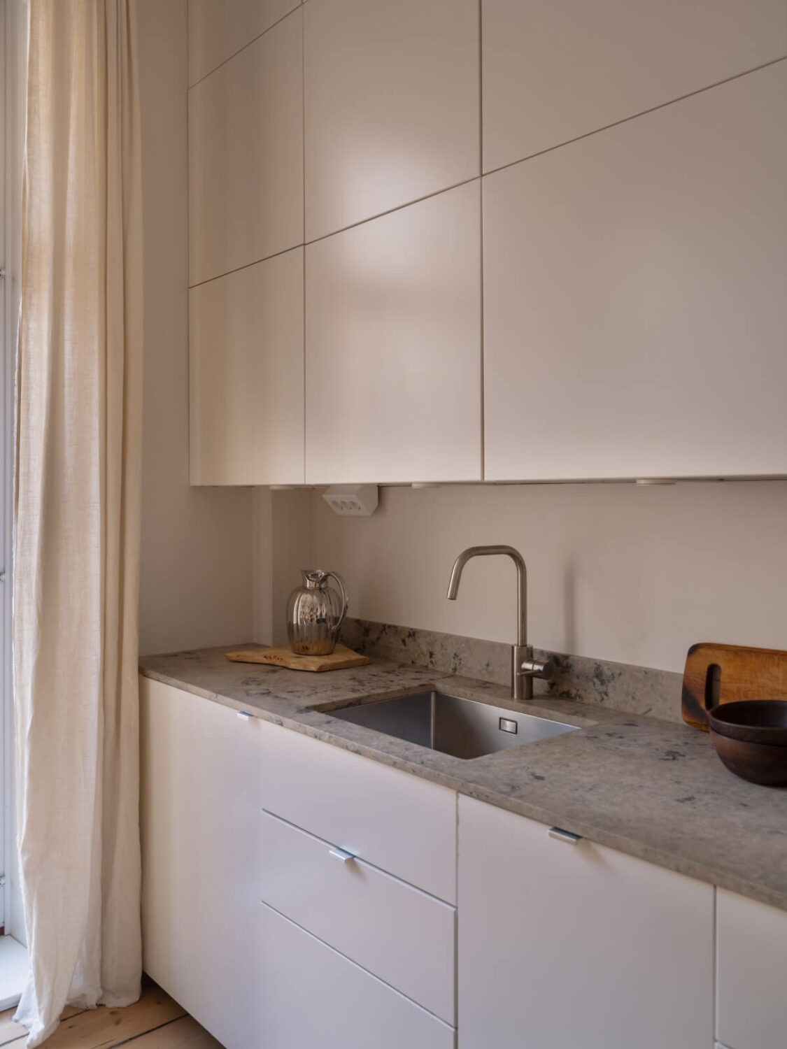 A Small Apartment with Contemporary Furniture in a 19th-Century Building 10 white kitchen detail