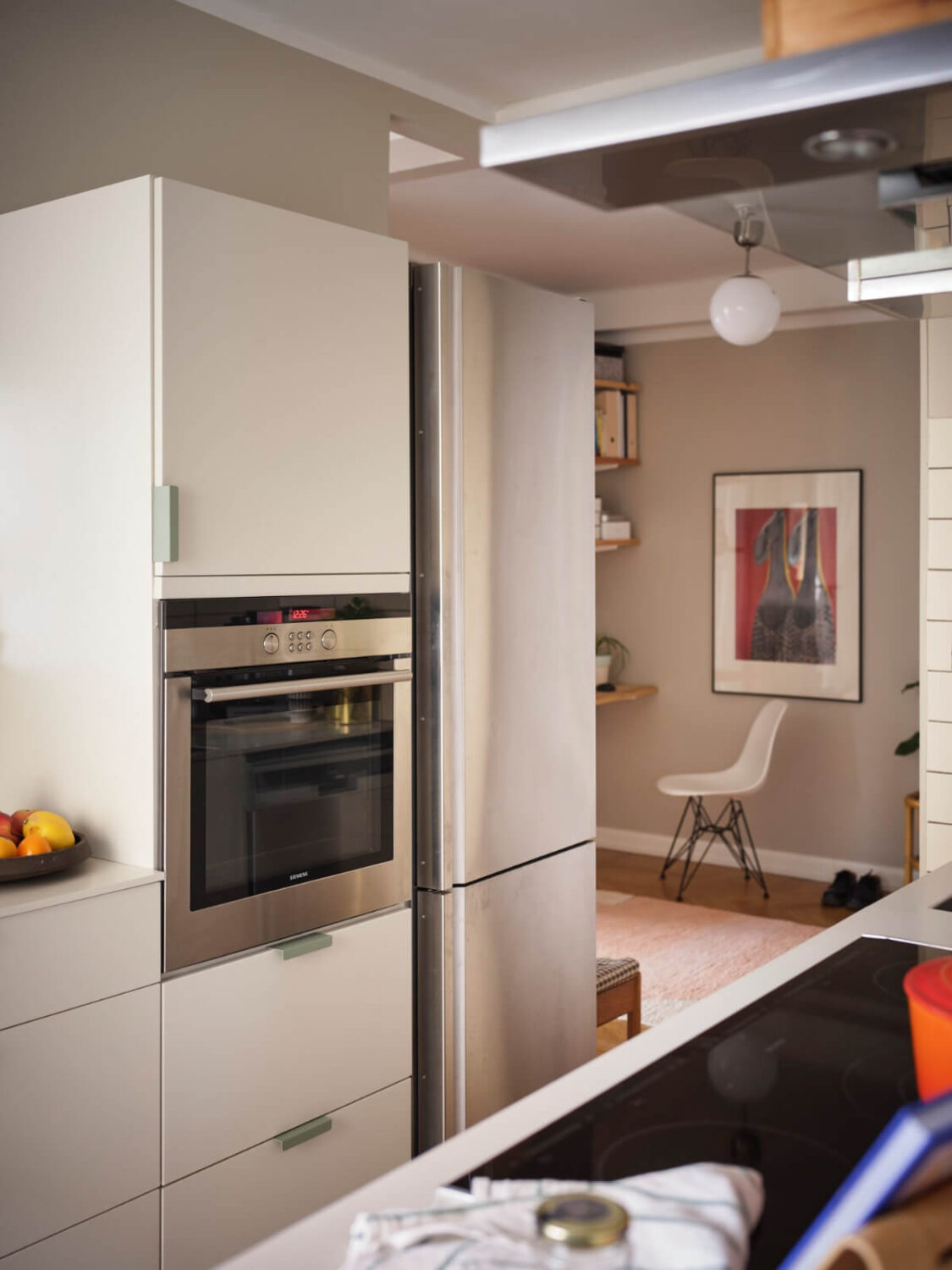 A Corner Apartment with Period Features and Bright Color Pops 10 white kitchen open layout
