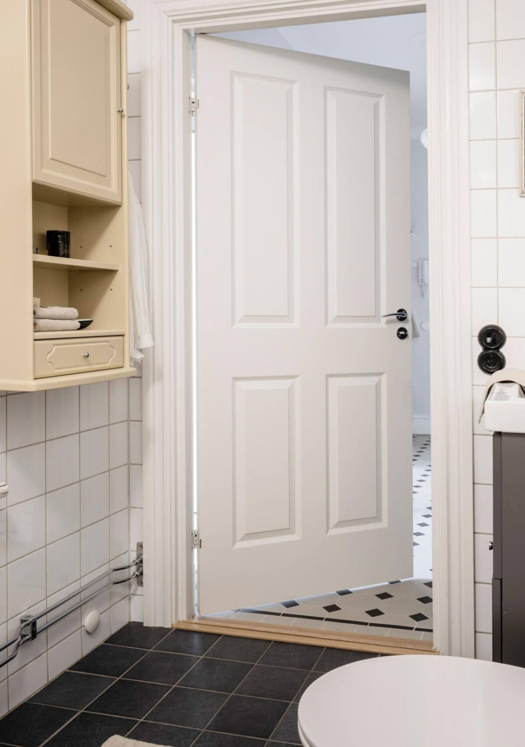 A Light Color Palette in a Stylish Renovated Late 19th Century Apartment 29 yellow bathroom cabinet