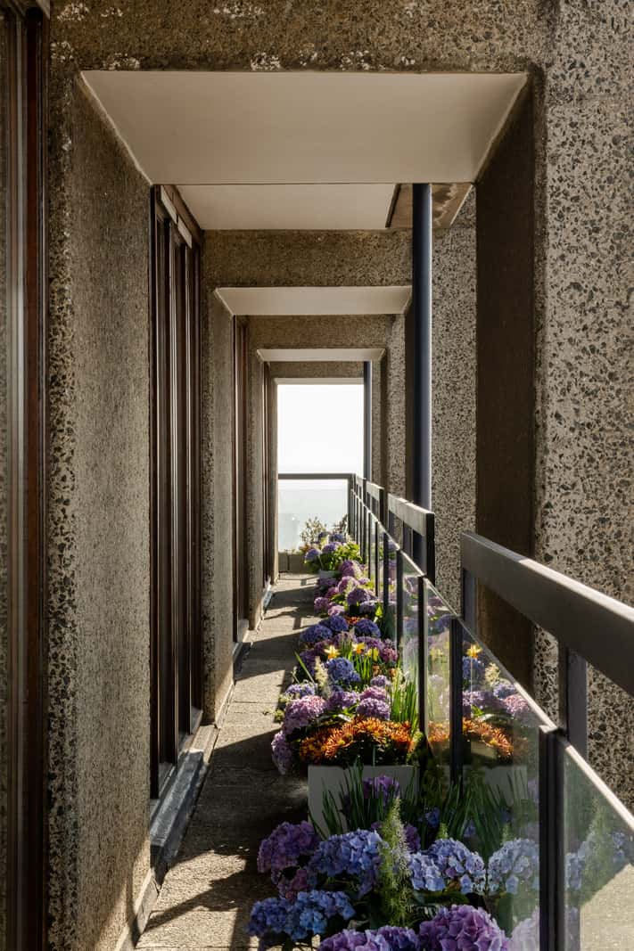 balcony 1 Oak and Marble in a Spectacular Brutalist Apartment in London