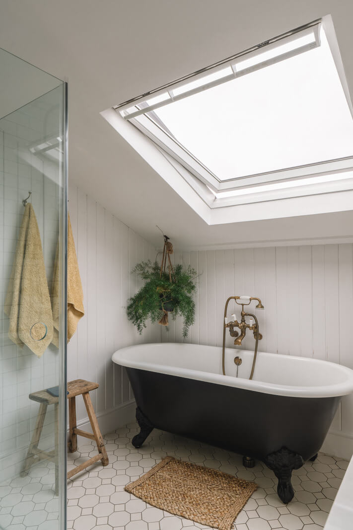 A Kitchen with Terracotta Tiles in a Renovated English Home 17 bathroom slanted ceiling black clawfoot bath