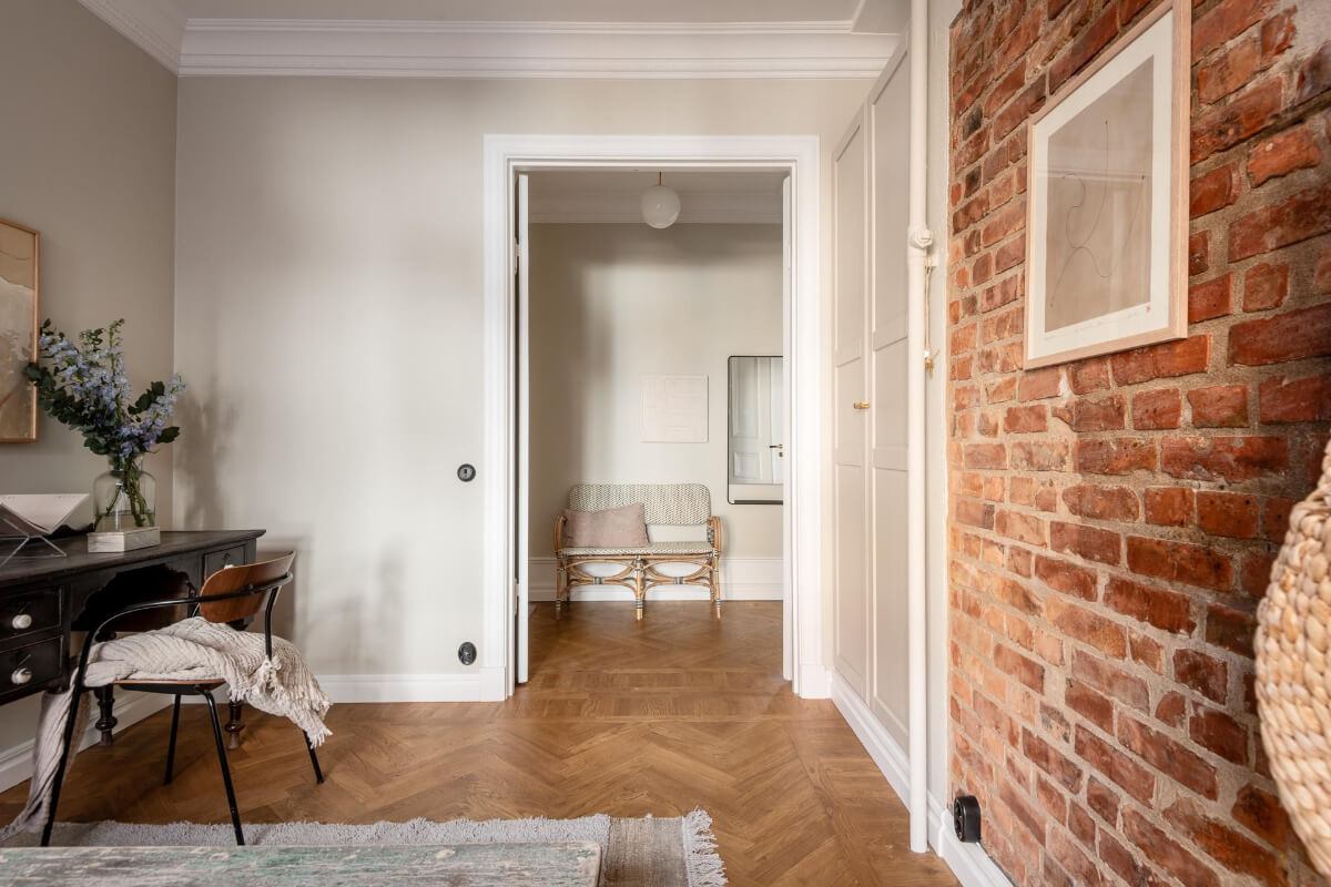 A Stunning Kitchen in a Classic Renovated Turn-of-the-Century Apartment 26 bedroom exposed brick antique desk built-in wardrobes