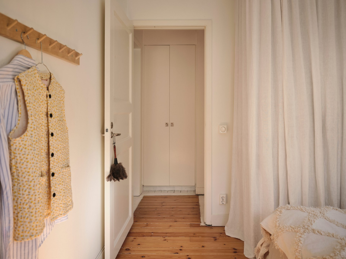 A Light-Filled Functionalist Apartment in Stockholm 15 bedroom wardrobes behind white curtain