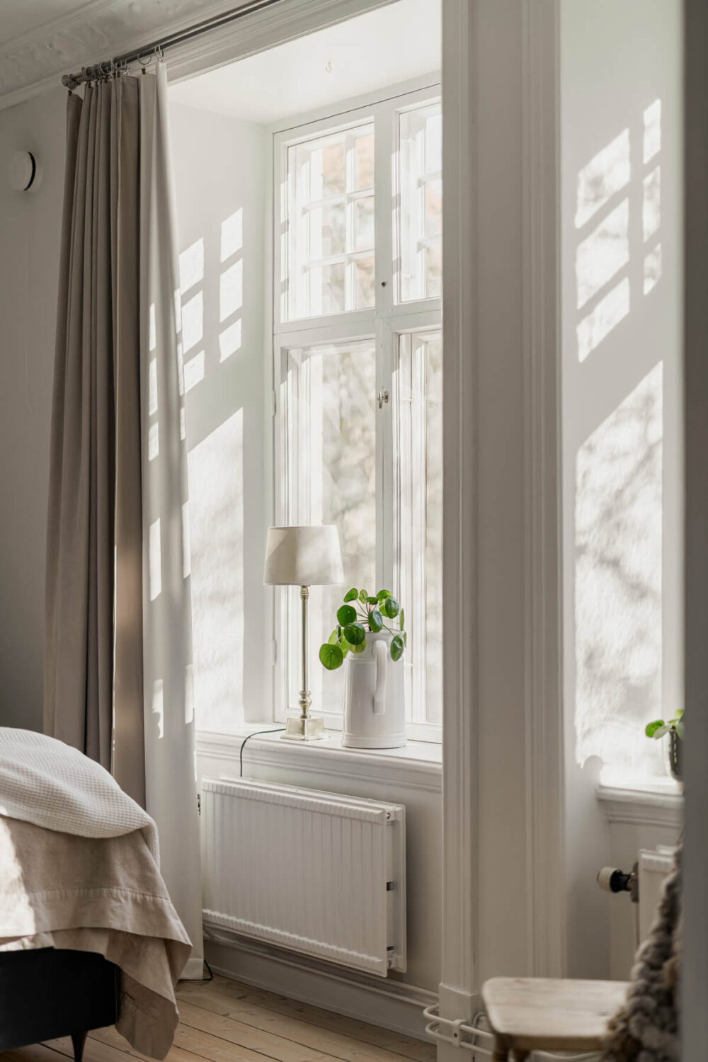 A Bright Swedish Apartment with Period Features and a Green Kitchen 19 bedroom windows