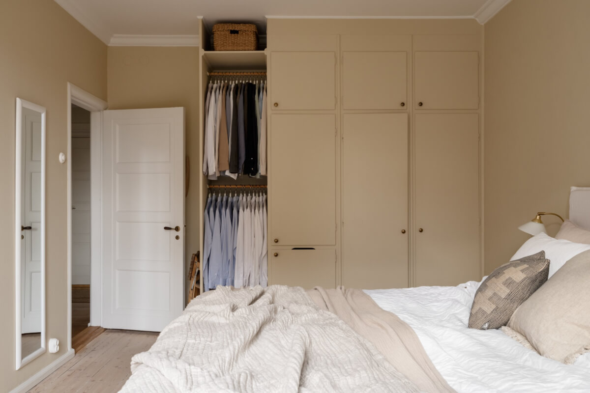 A Beige Color Palette and Built-in Bookshelves in a 1920s Apartment 16 beige bedroom built-in wardrobes
